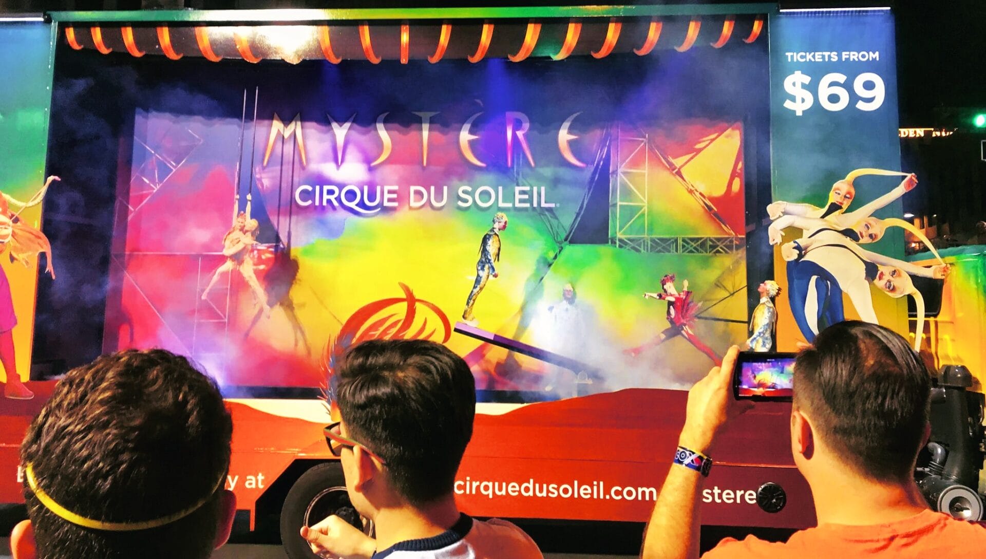 Cirque du Soleil Mystere show advertisement with audience.