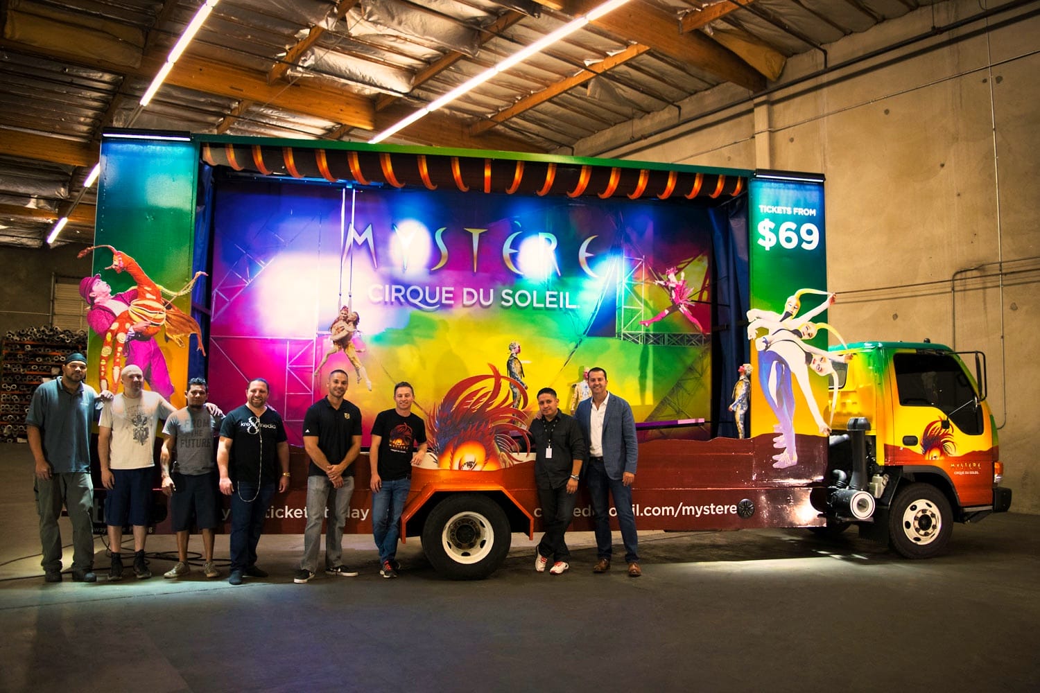 workers standing in front of finished mobile billboard in Las Vegas shop