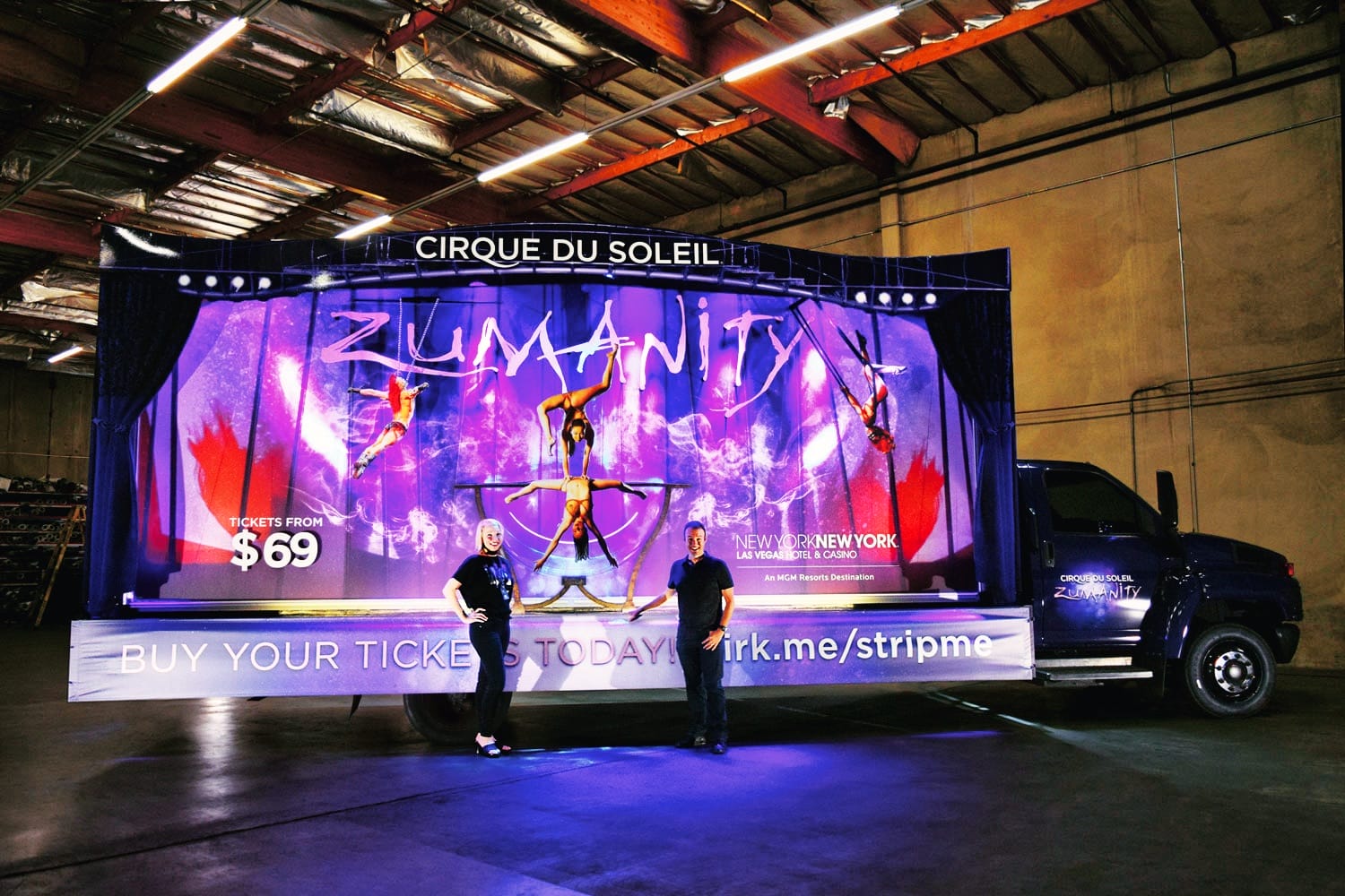 Cirque du Soleil Zumanity billboard with people and truck.