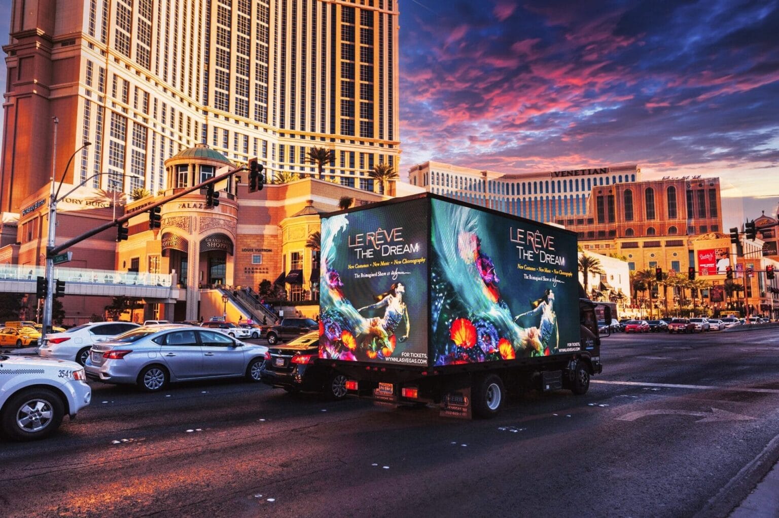 Las Vegas street with billboard truck advertising Le Rêve show.