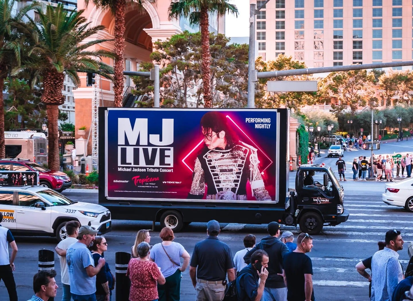 Mobile billboard promoting concert in urban setting