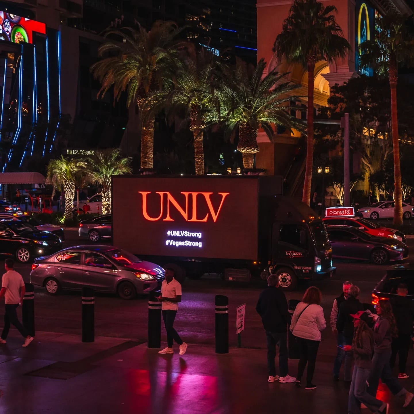 UNLV sign with hashtag on Las Vegas street at night
